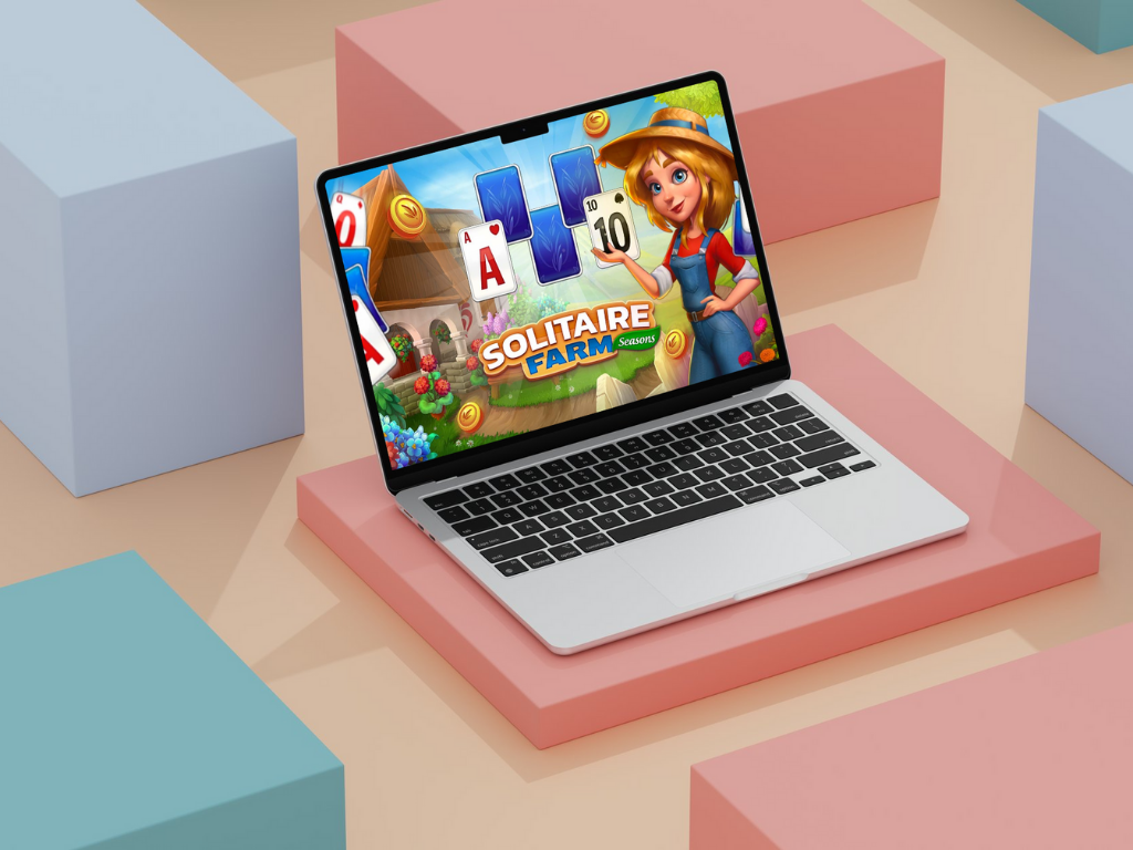 Colorful monitor display featuring SOFTGAMES’ Solitaire Farm: Seasons game, with a character in farm attire and thematic card graphics representing the engaging design of SOFTGAMES HTML5 titles.